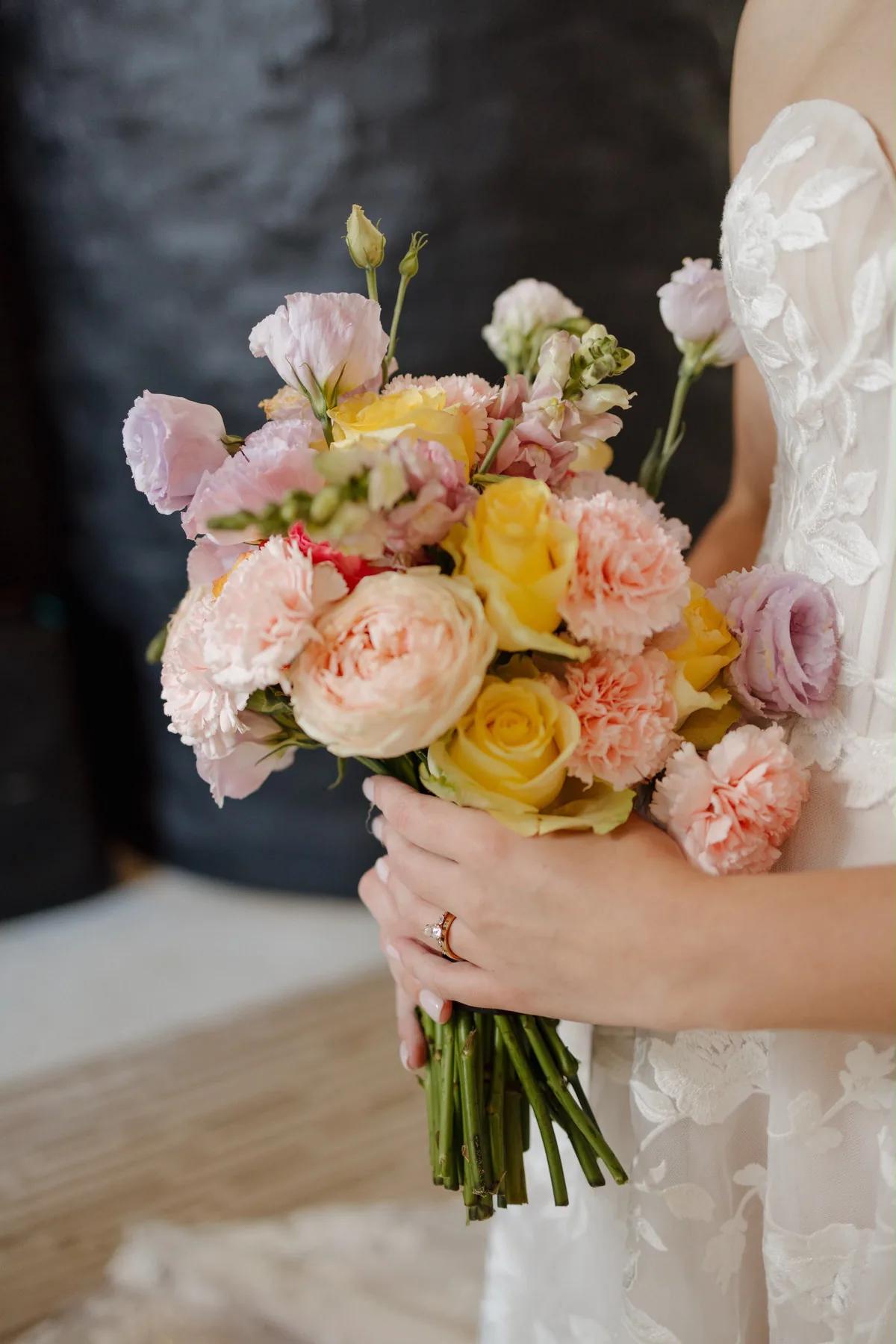 Pastel bridal bouquet held by the bride