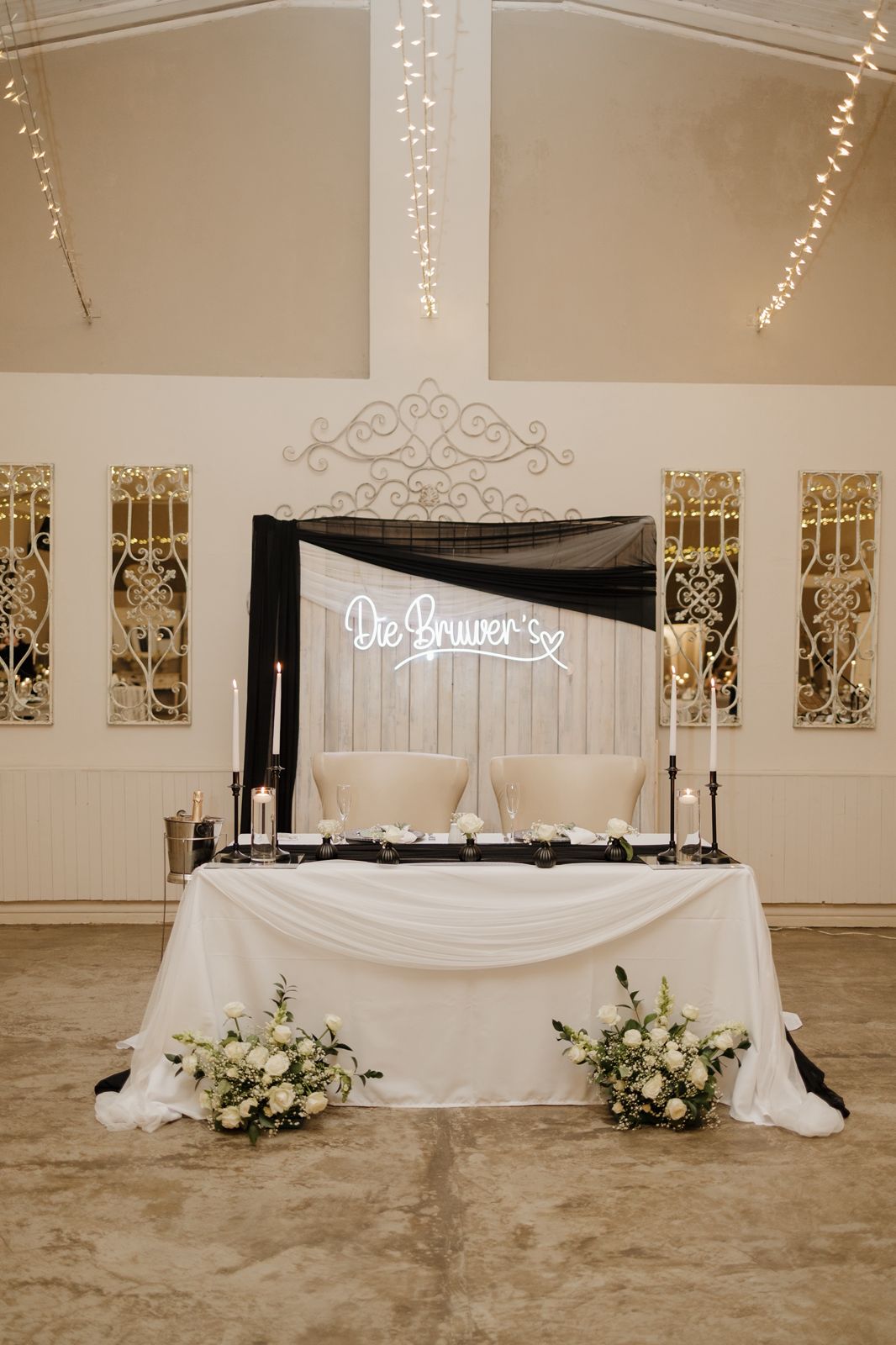 Bridal table with draping, candles and florals