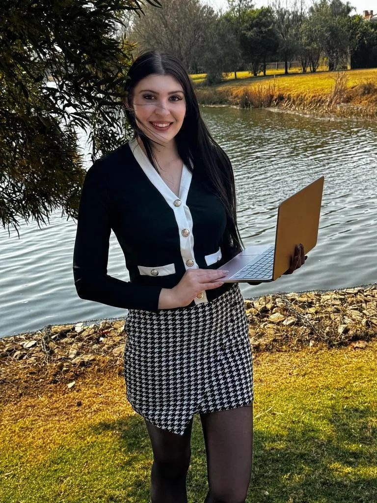 Planner working from a laptop at a riverside venue
